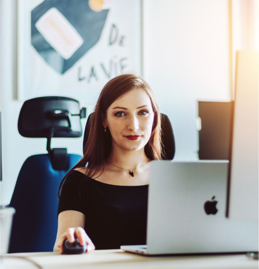 A woman in front of computer